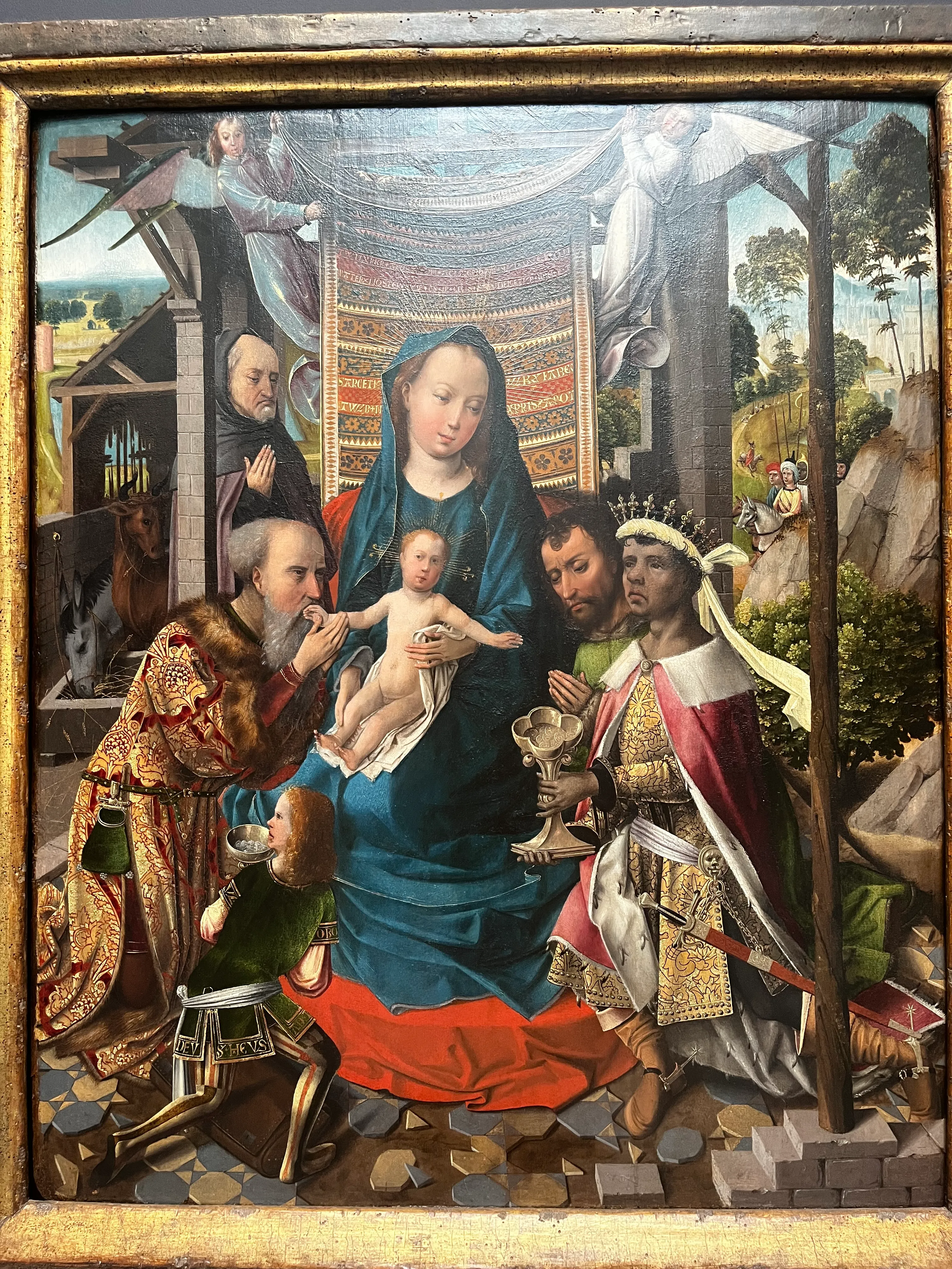 Maria met het kind en verschillende figuren in een gedetailleerd schilderij